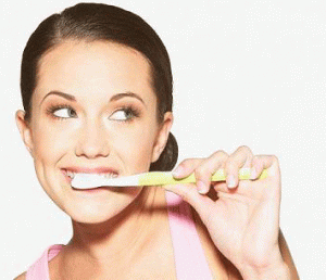 Oral Hygiene A young lady demonstrating good oral hygiene.