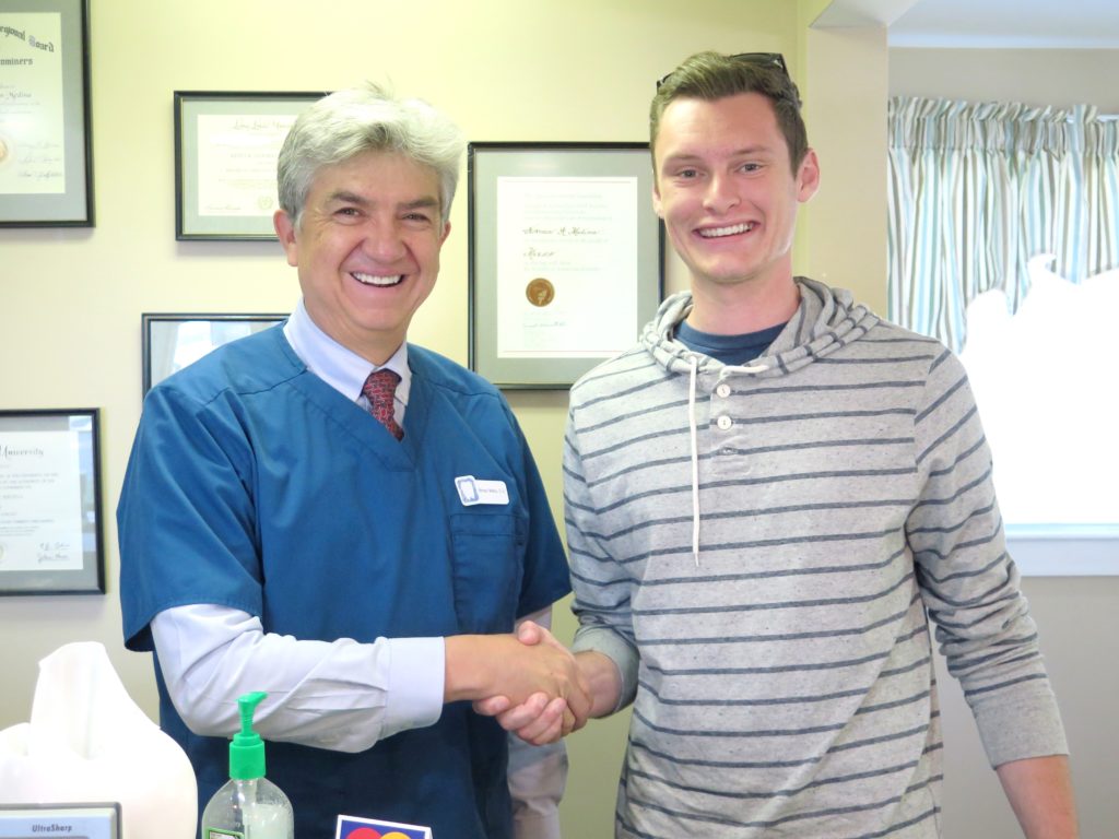 Justin Robinson with Dr. Medina